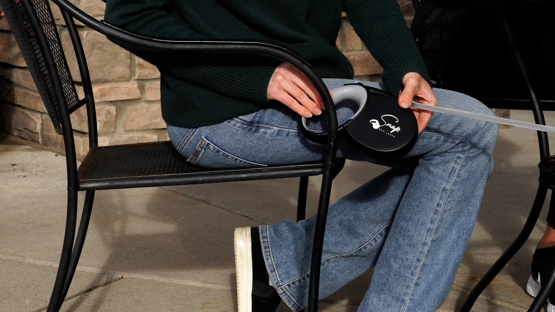 Hands-free dog leash clipped at an outdoor tailgate event